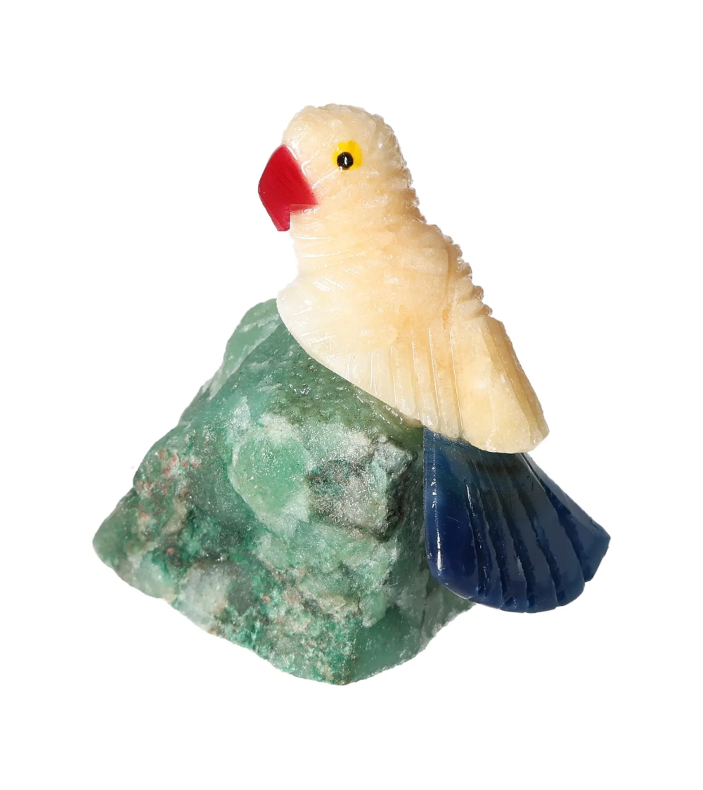 Yellow Calcite Parrot On Quartz 636414 figurine on green quartz background, ideal for chakra and zodiac energy alignment.