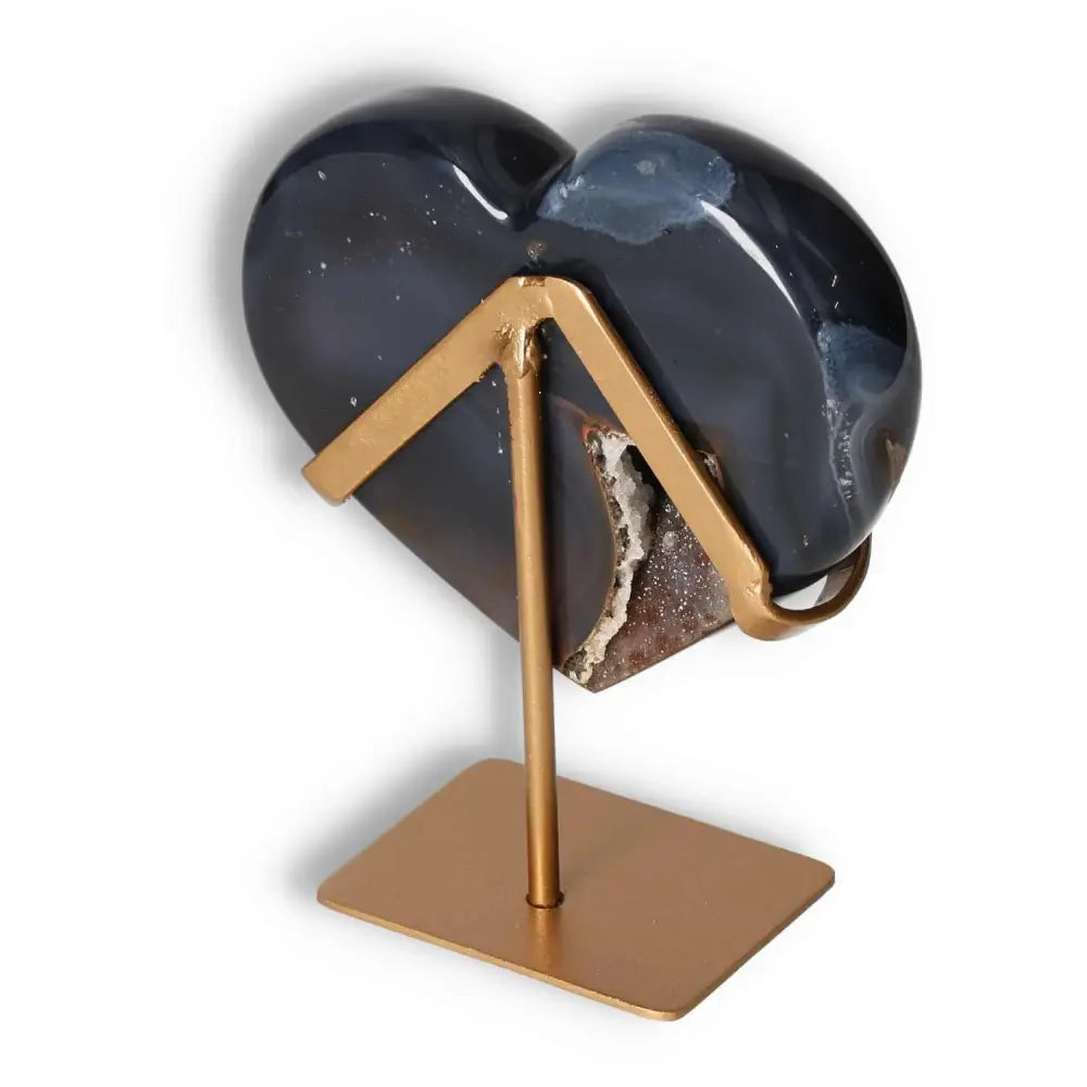 Elegant Agate Heart crystal on stand, enhancing energy harmony and grounding, a luxurious Sylvia Crystals creation for home decor.