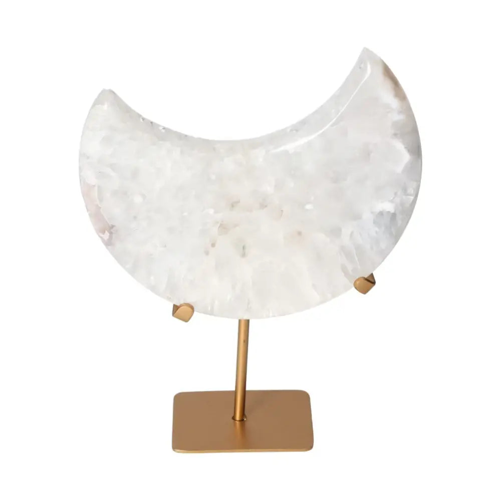 Agate lunar crescent sculpture on a stand, showcasing translucent off-white swirls with a natural geode center, elegant and ethereal.