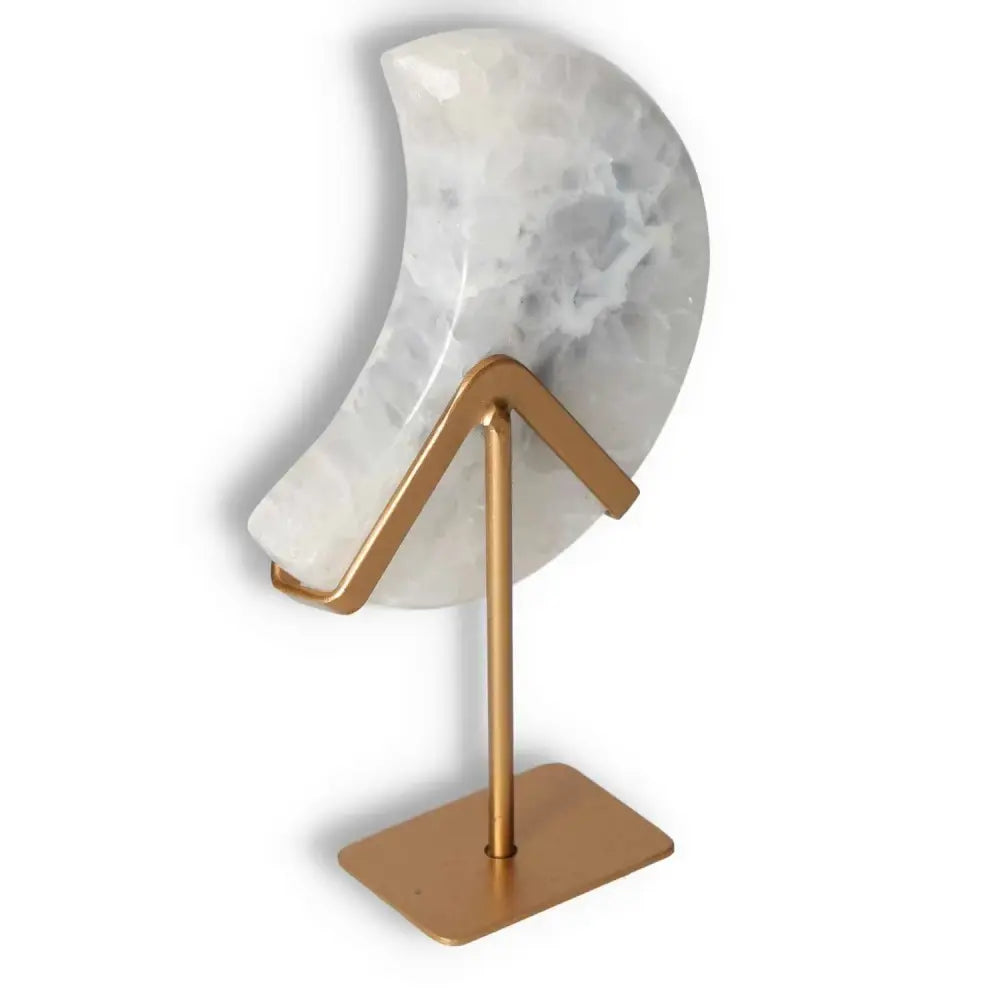 Agate Lunar Crescent - a luminous off-white crescent shaped from premium agate, with a central geode formation, displayed on a stand.