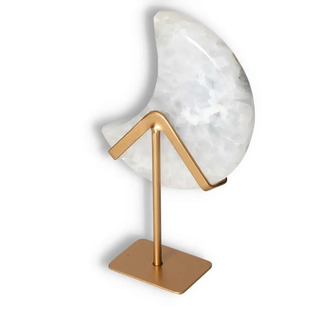 Elegant agate lunar crescent with soft swirls on a sleek gold stand, combining natural artistry and celestial elegance for home decor.