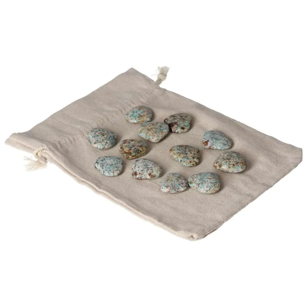 Amazonite small hearts on a neutral fabric pouch, highlighting the stone's calming and balancing properties for emotional well-being.
