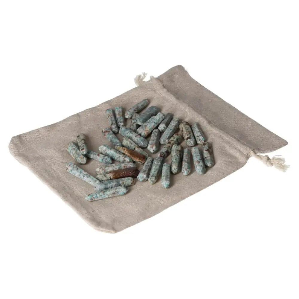 Amazonite small sticks on a beige cloth pouch, known for harmony and calming effects, enhancing emotional balance and security.