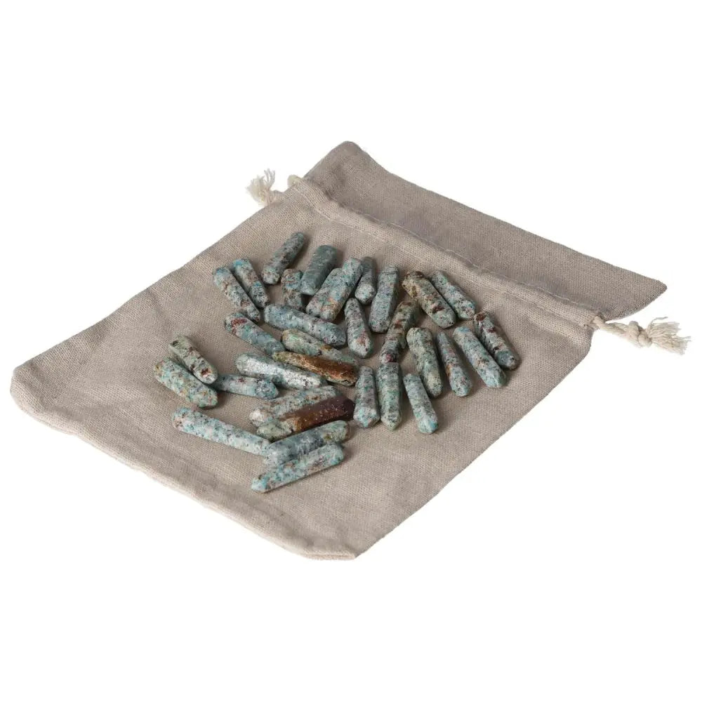 Amazonite small sticks on a beige pouch, promoting harmony and emotional balance with calming properties.