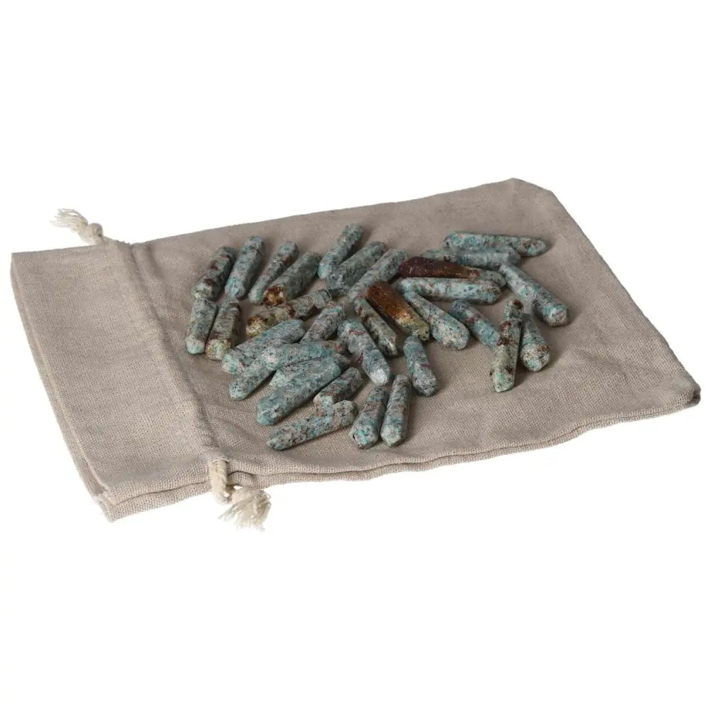Amazonite small sticks on fabric pouch, known for balancing emotions and providing a calming effect.