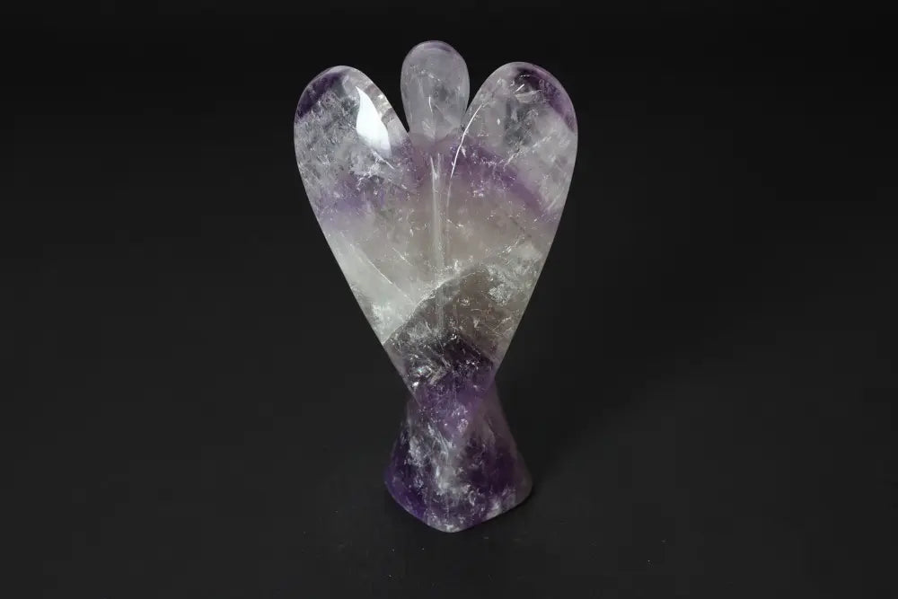 15 cm Angel Amethyst statue, enhances concentration and emotional stability, stress relief and energy boost crystal on dark background.