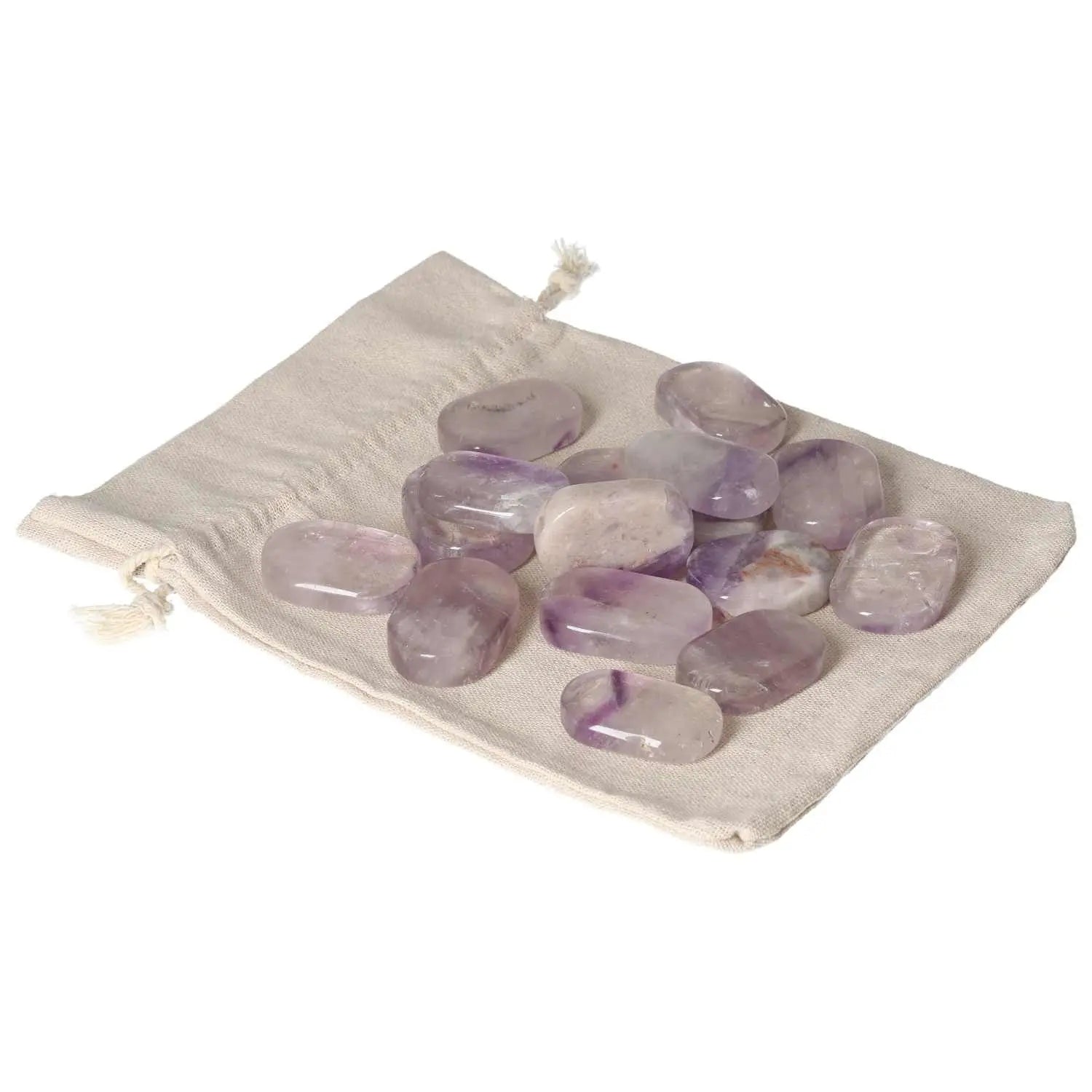 Amethyst stones on a beige cloth, ideal for stress relief and enhancing concentration.