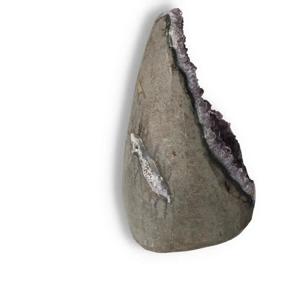 Amethyst Cut Base Geode from Sylvia Crystals, showcasing luxury and spiritual energy with its stress-alleviating properties.