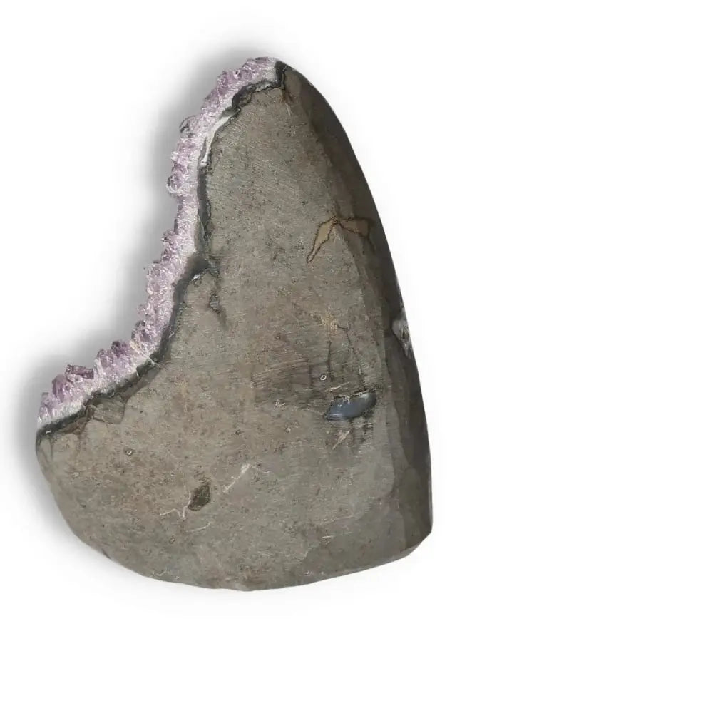 Amethyst Cut Base Geode with exposed crystals showcasing luxury and spiritual energy from Sylvia Crystals, known for stress relief benefits.