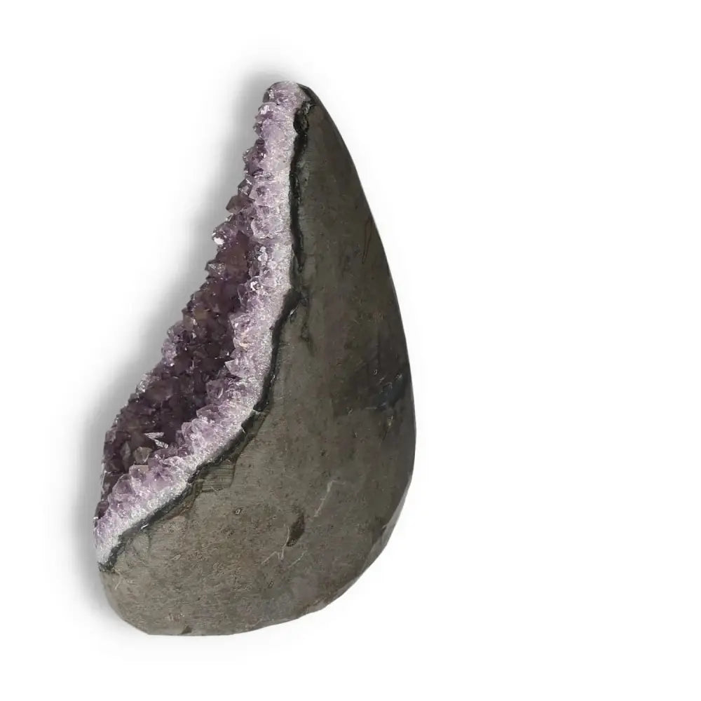 Amethyst Cut Base Geode from Sylvia Crystals, showcasing stunning purple crystals, known for stress relief and enhancing energy.