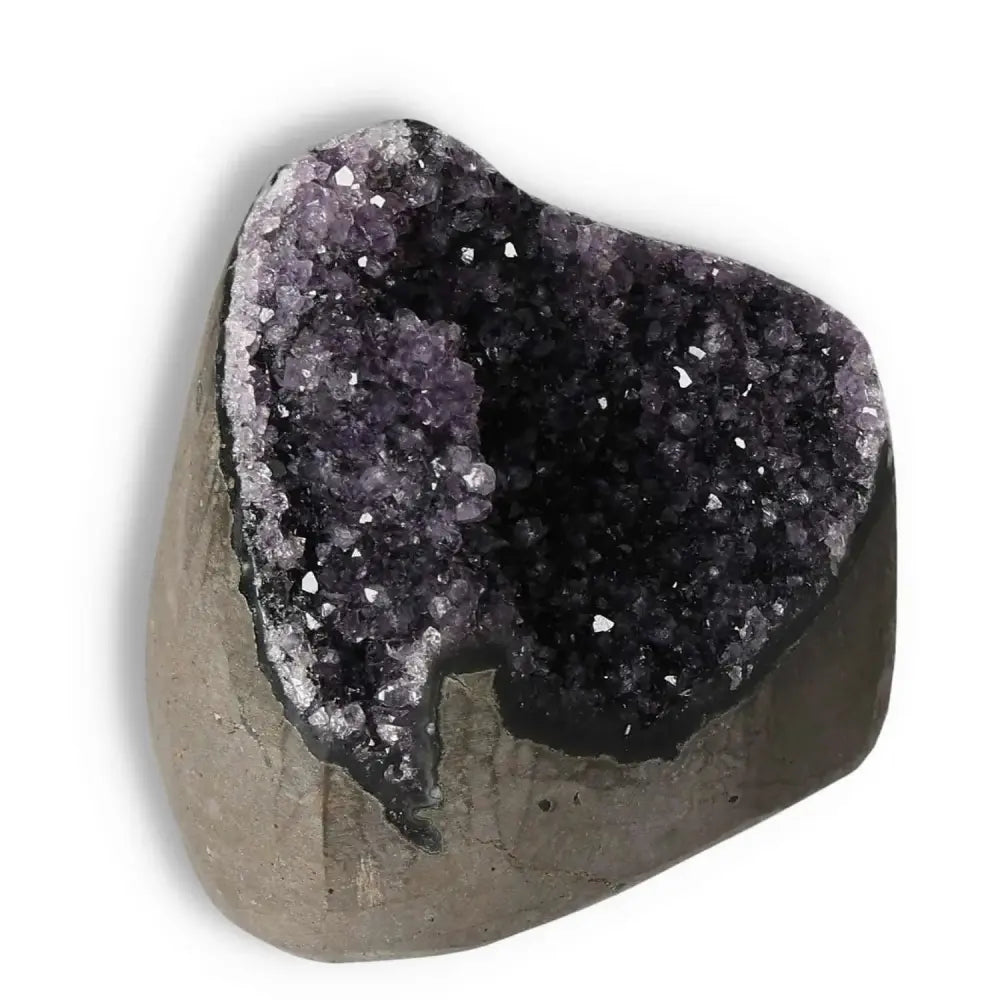 Amethyst Cut Base Geode from Sylvia Crystals, highlighting luxury and spiritual benefits, enhances energy and emotional stability.