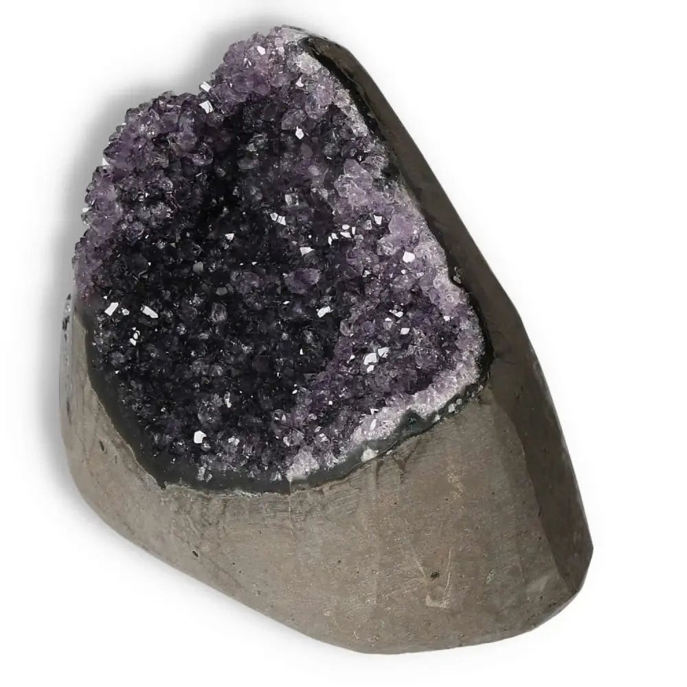 Amethyst Cut Base Geode by Sylvia Crystals, enhancing concentration and emotional stability with natural luxury.