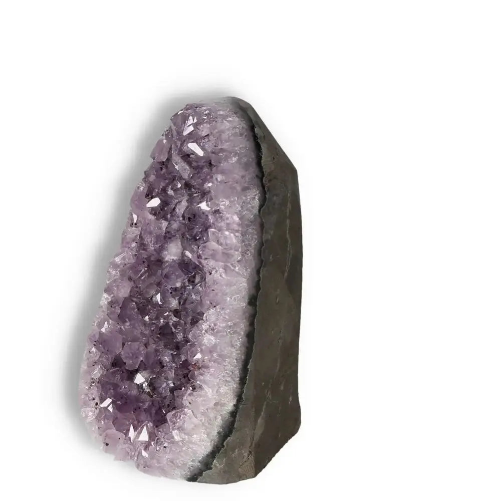 Amethyst Cut Base Geode by Sylvia Crystals, showcasing vibrant purple hues, luxury, and spiritual harmony.