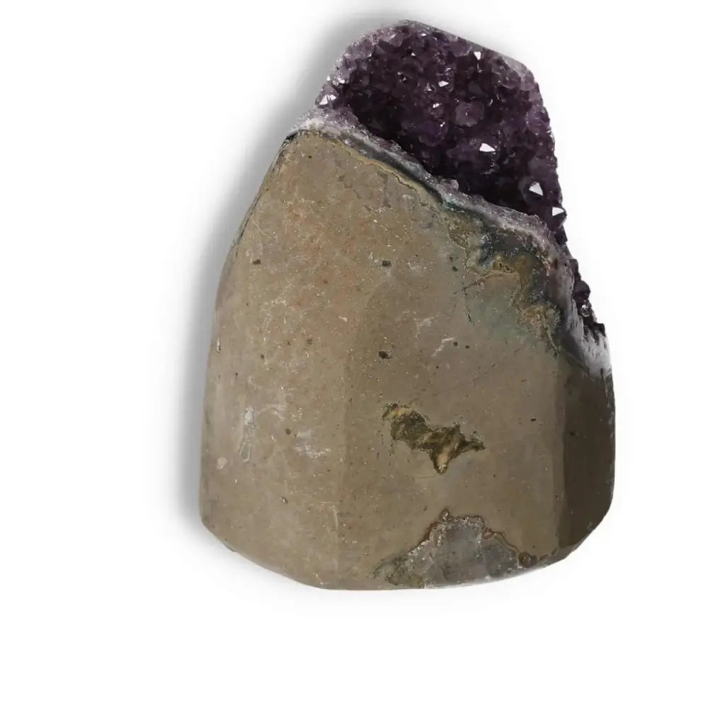 Amethyst Cut Base Geode showcasing its natural beauty and tranquil energy, available from Sylvia Crystals for holistic balance.