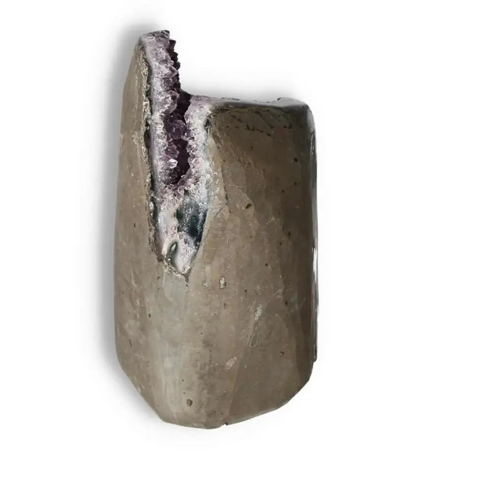 Amethyst Cut Base Geode with calming properties, offered by Sylvia Crystals, showcasing a harmonious balance of beauty and function.