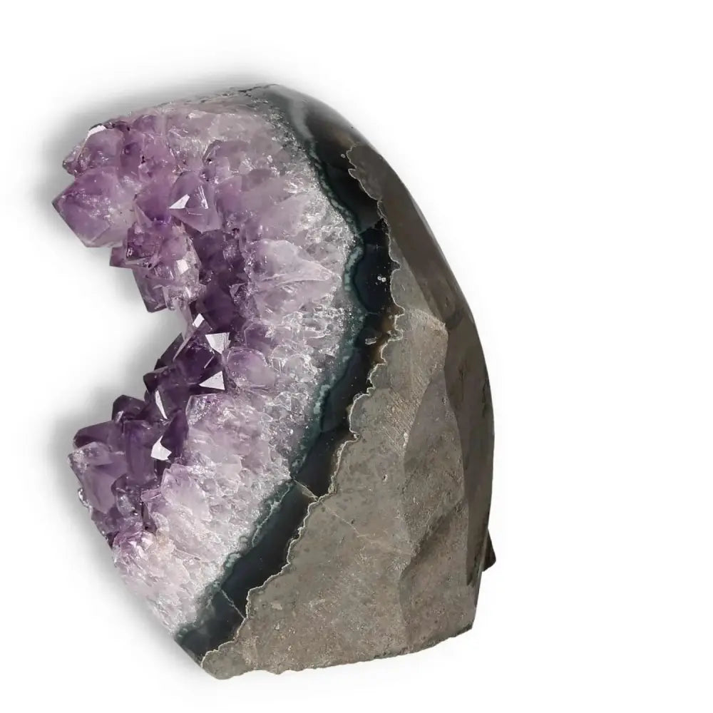 Amethyst cut base geode with deep purple crystals from Sylvia Crystals, ideal for enhancing concentration and emotional stability.