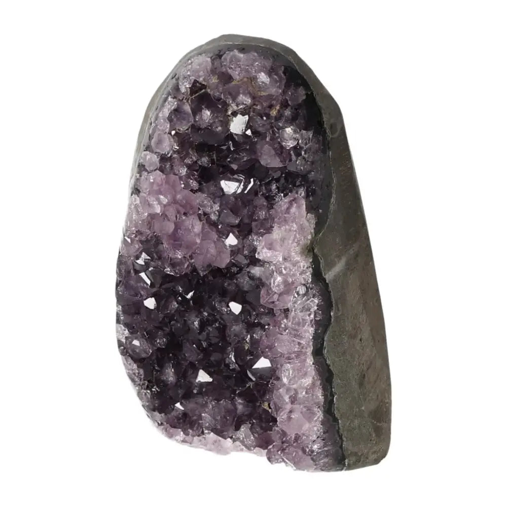 Amethyst cut base geode from Sylvia Crystals, showcasing luxury and spiritual enrichment with stress-reducing properties.