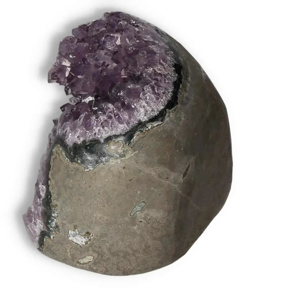 Amethyst Cut Base Geode from Sylvia Crystals showcasing dazzling purple crystals and natural rock base, ideal for stress relief and focus.