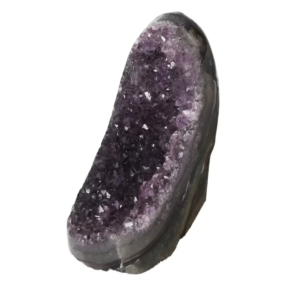 Amethyst Cut Base Geode with deep purple hues, luxury gemstone from Sylvia Crystals, blend of spirituality and modern design.