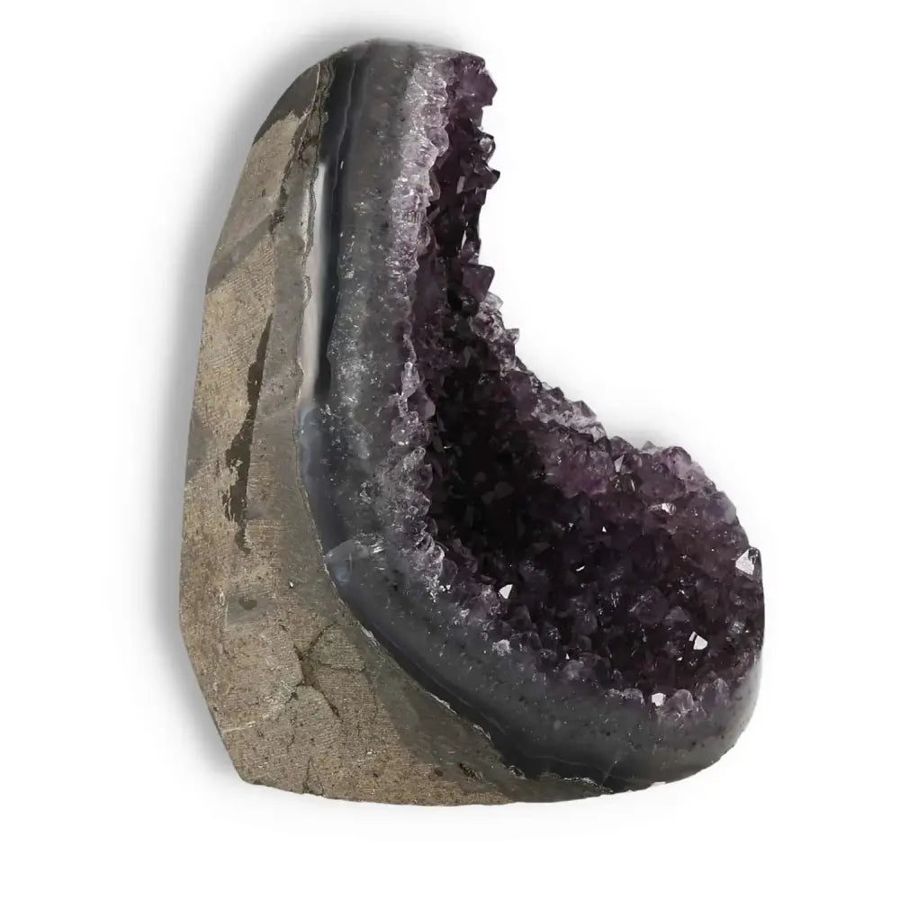 Amethyst Cut Base Geode with deep purple crystals, embodying luxurious essence from Sylvia Crystals, perfect for spiritual elegance.
