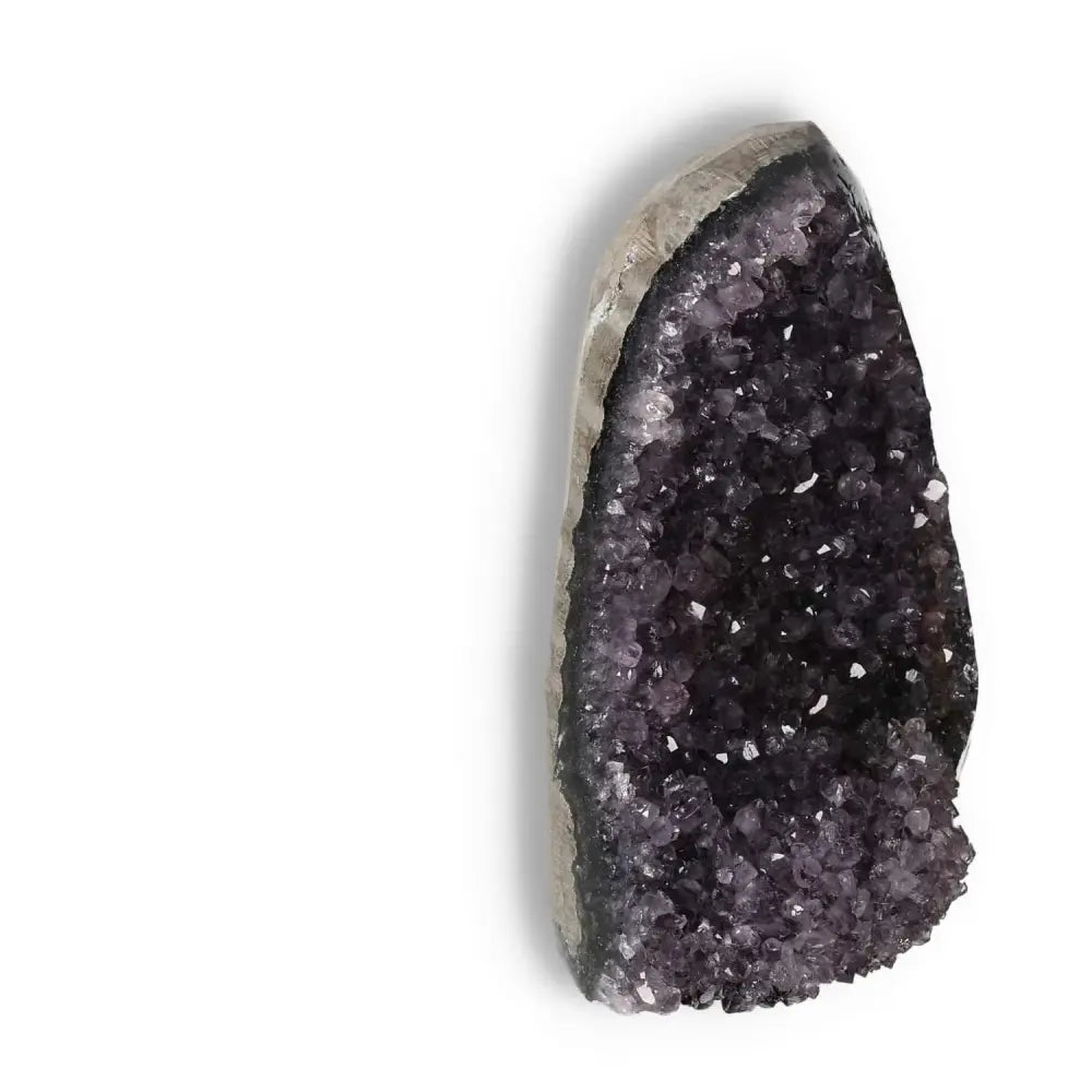 Amethyst Cut Base Geode from Sylvia Crystals, known for stress reduction and boosting energy; a luxurious decorative piece.