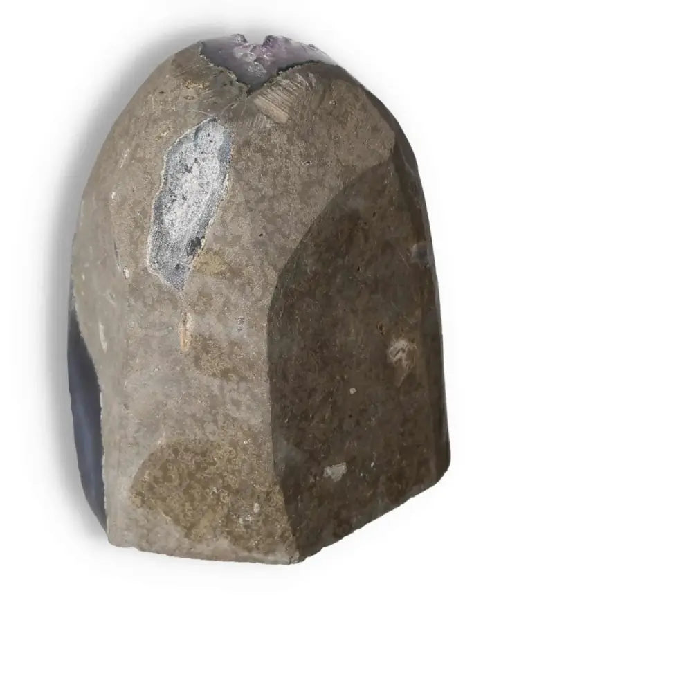 Amethyst Cut Base Geode from Sylvia Crystals, showcasing natural stone texture and intricate purple detailing.