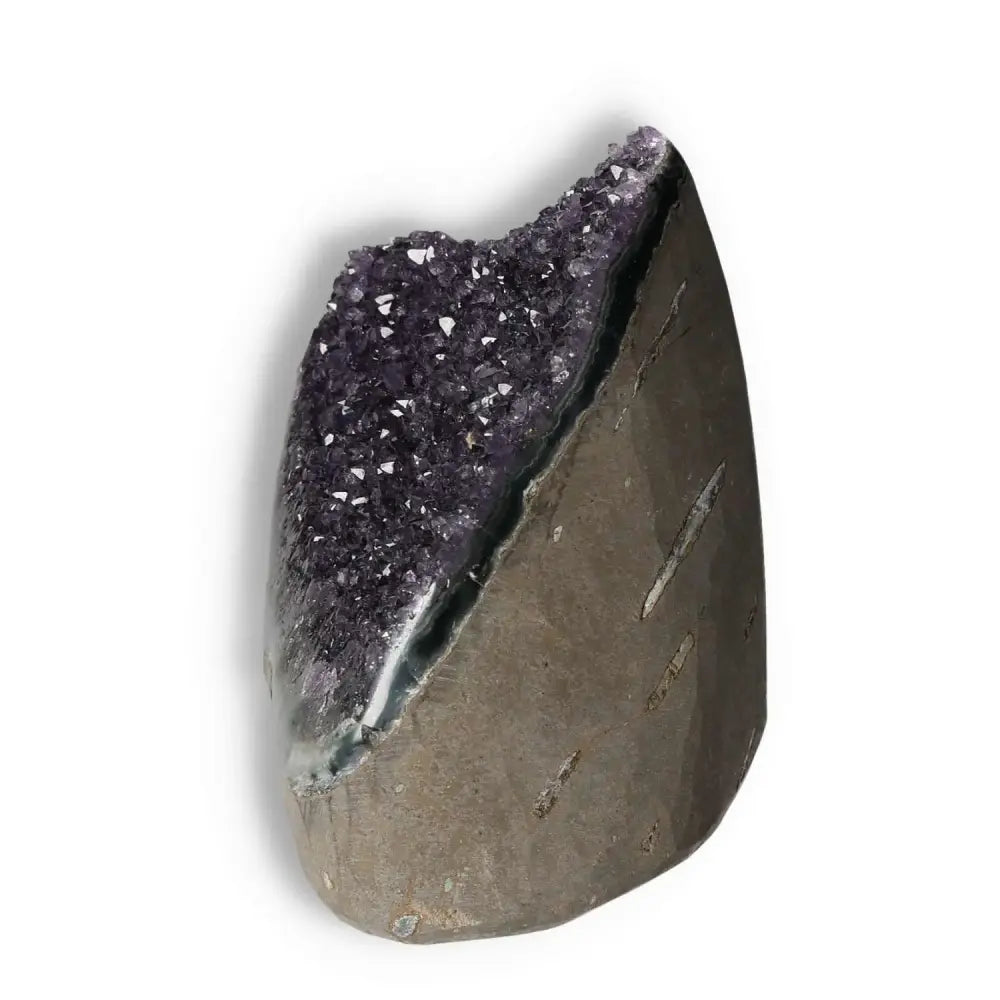 Amethyst Cut Base Geode with sparkling purple crystals, luxurious and spiritual, from Sylvia Crystals, showcasing stress-reducing qualities.