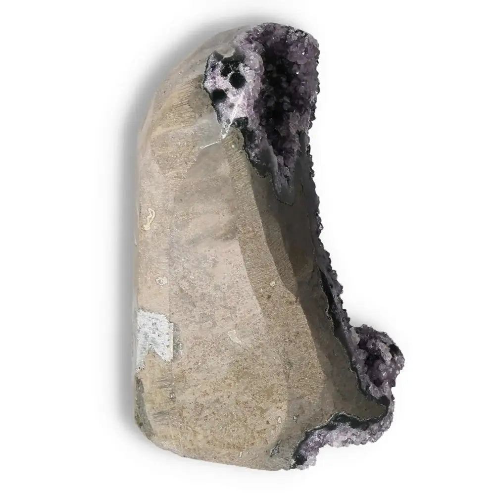 Amethyst Cut Base Geode from Sylvia Crystals, showcasing a unique structure and deep purple crystal interior for energy and wellness.