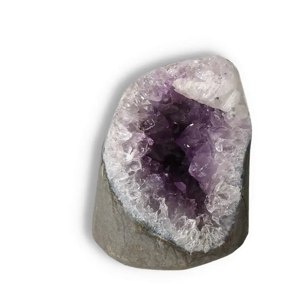 Amethyst cut base geode with vibrant purple crystals from Sylvia Crystals, showcasing elegance and spiritual depth.