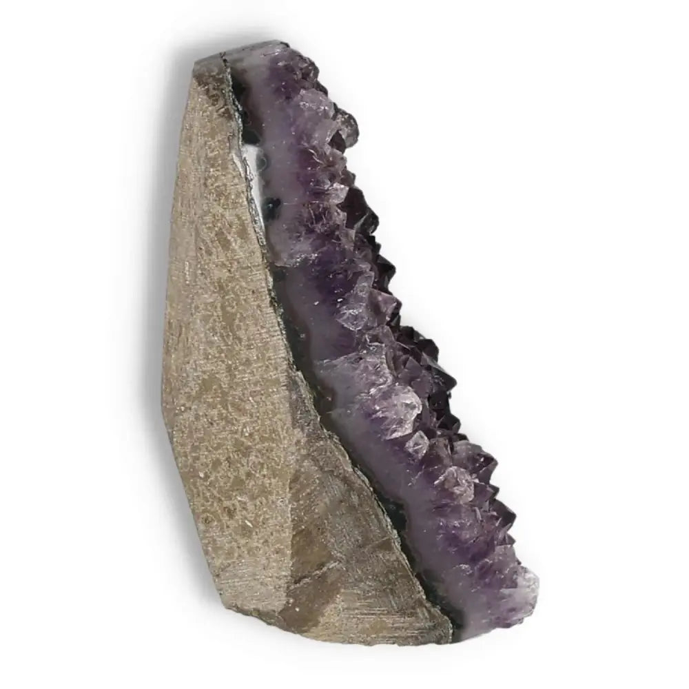 Amethyst Cut Base Geode by Sylvia Crystals, a decorative talisman for stress reduction and energy enhancement, enhancing emotional stability.
