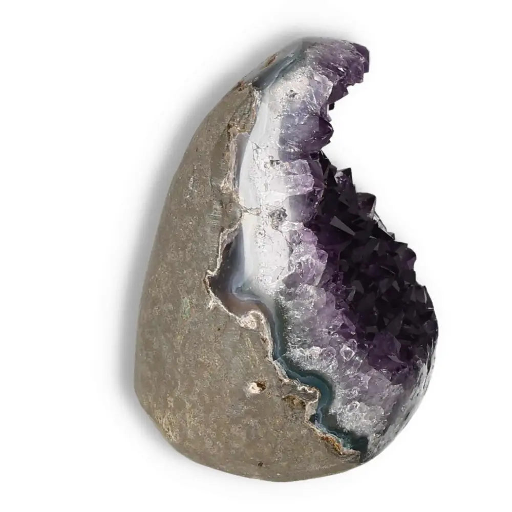 Amethyst Cut Base Geode from Sylvia Crystals showcasing violet hues, offering beauty and spiritual depth.