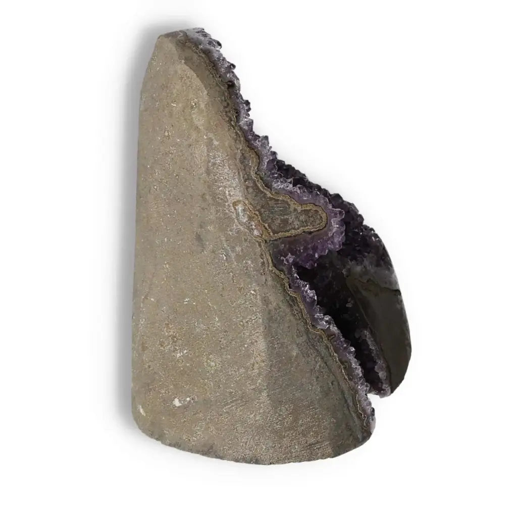 Amethyst Cut Base Geode with purple crystal interior from Sylvia Crystals, highlighting its luxury and spiritual benefits.