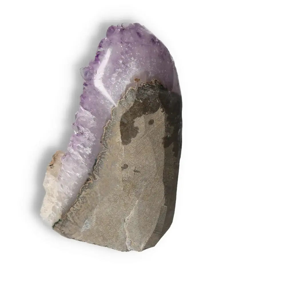 Amethyst cut base geode from Sylvia Crystals, showcasing its purple hues and elegant form. Ideal for enhancing tranquility and focus.