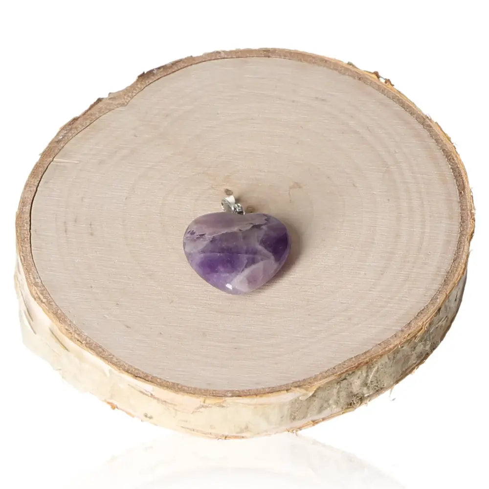 Amethyst heart pendant 20mm on wood slice, showcasing violet hue and elegance, perfect for spiritual harmony and chic style.