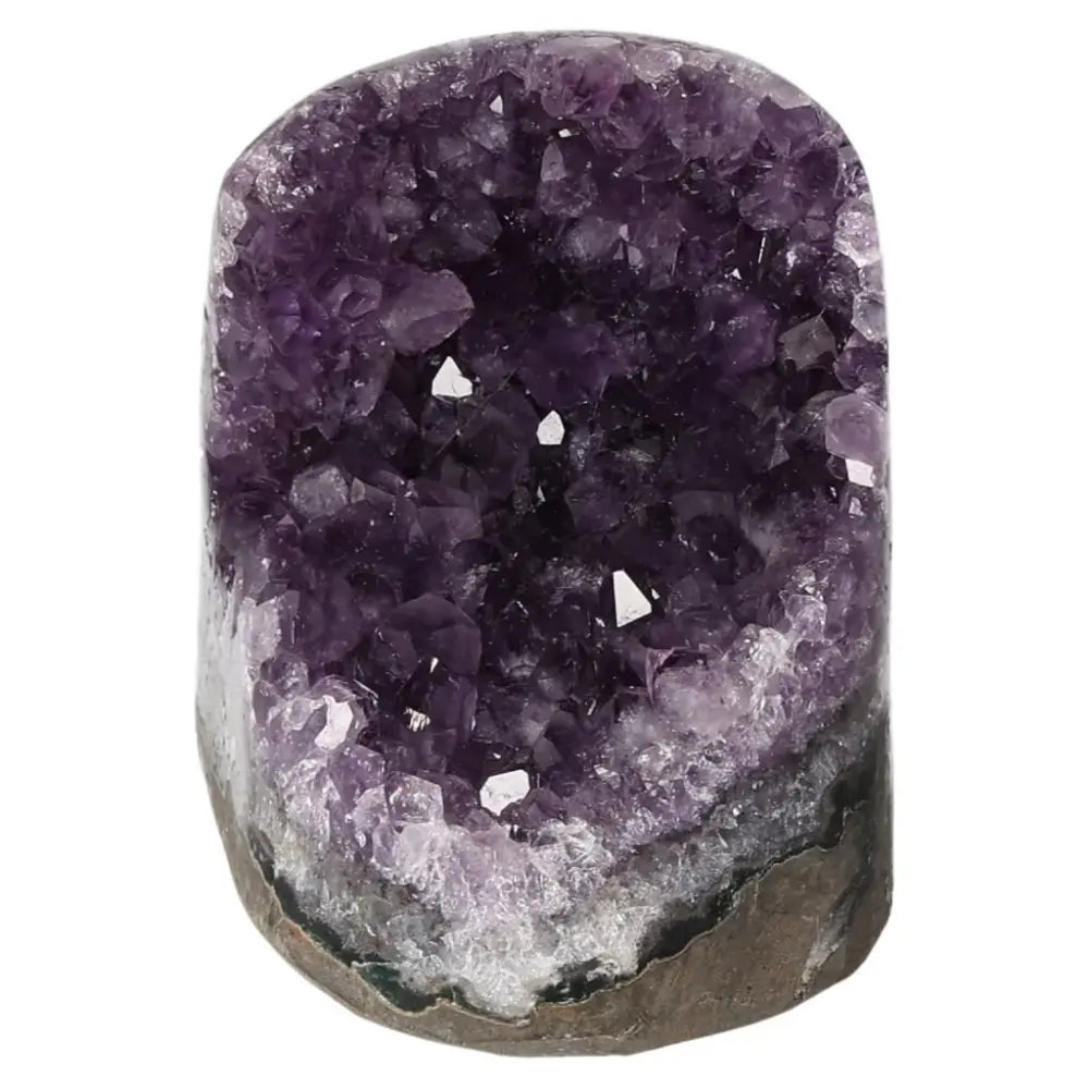 Amethyst cut base geode from Sylvia Crystals with deep purple crystals, known for stress reduction and enhancing concentration.