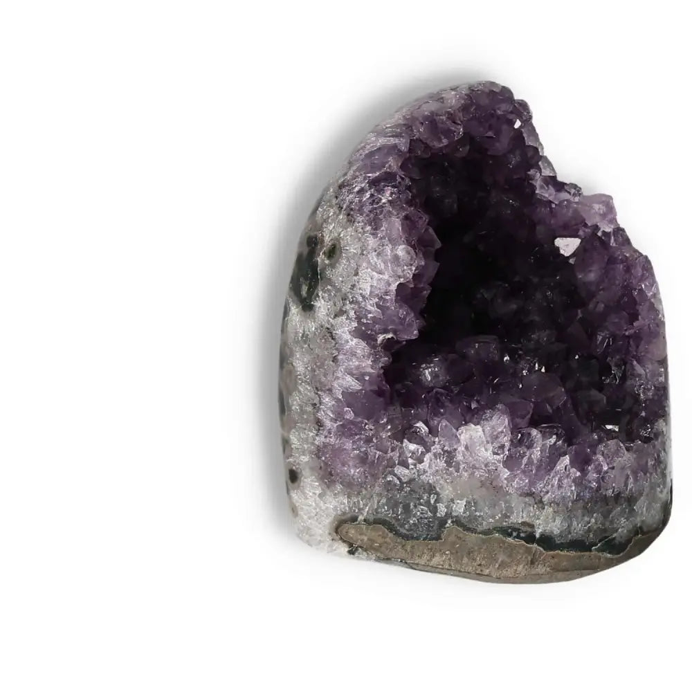 Amethyst cut base geode by Sylvia Crystals with deep purple hues, known for reducing stress and enhancing concentration.