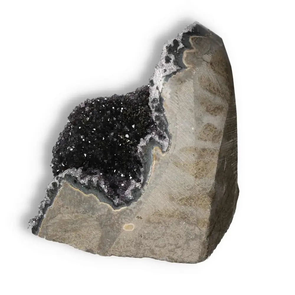 Amethyst cut base geode from Sylvia Crystals showcasing its glittering interior and natural stone exterior, perfect for enhancing tranquility.