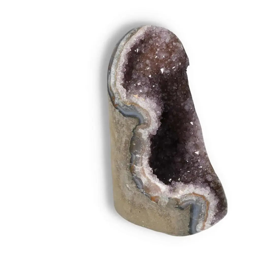Amethyst cut base geode from Sylvia Crystals, featuring shimmering purple hues and natural energy-boosting properties.