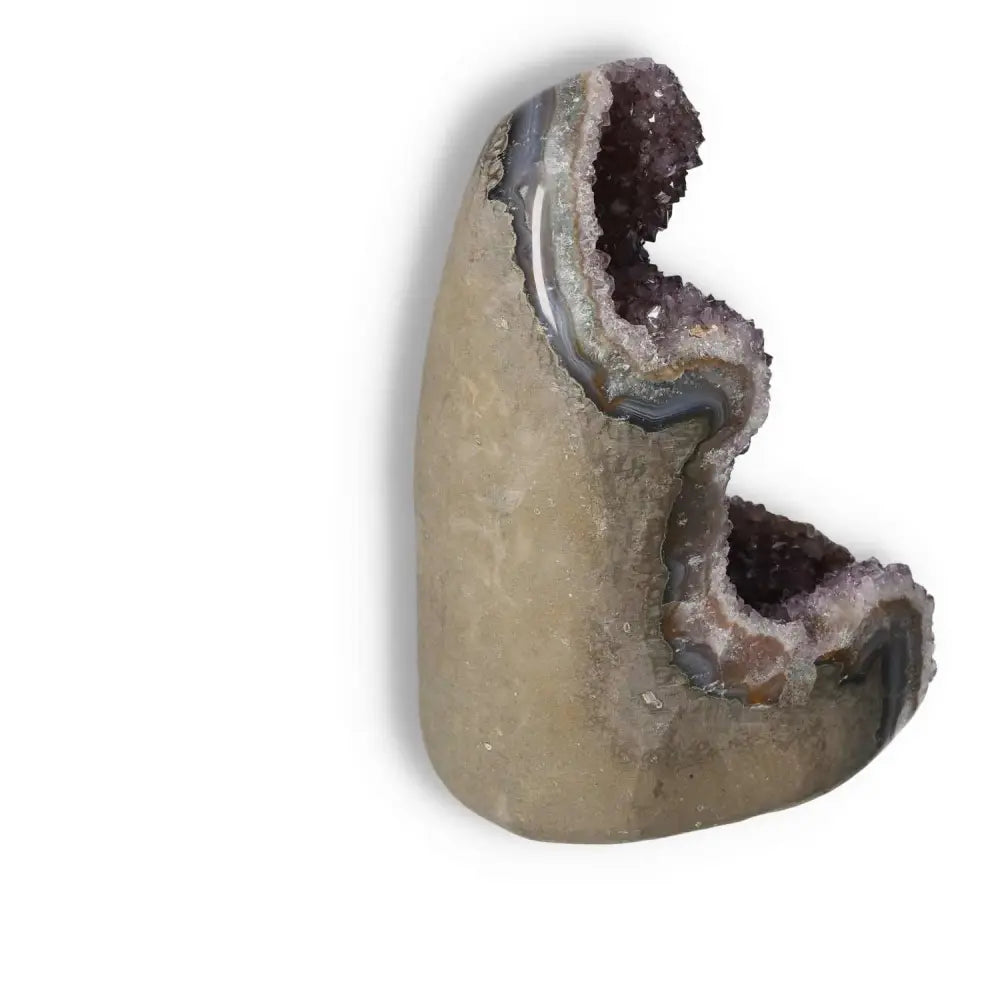 Amethyst cut base geode from Sylvia Crystals, displaying natural energy properties and enhancing concentration and emotional stability.