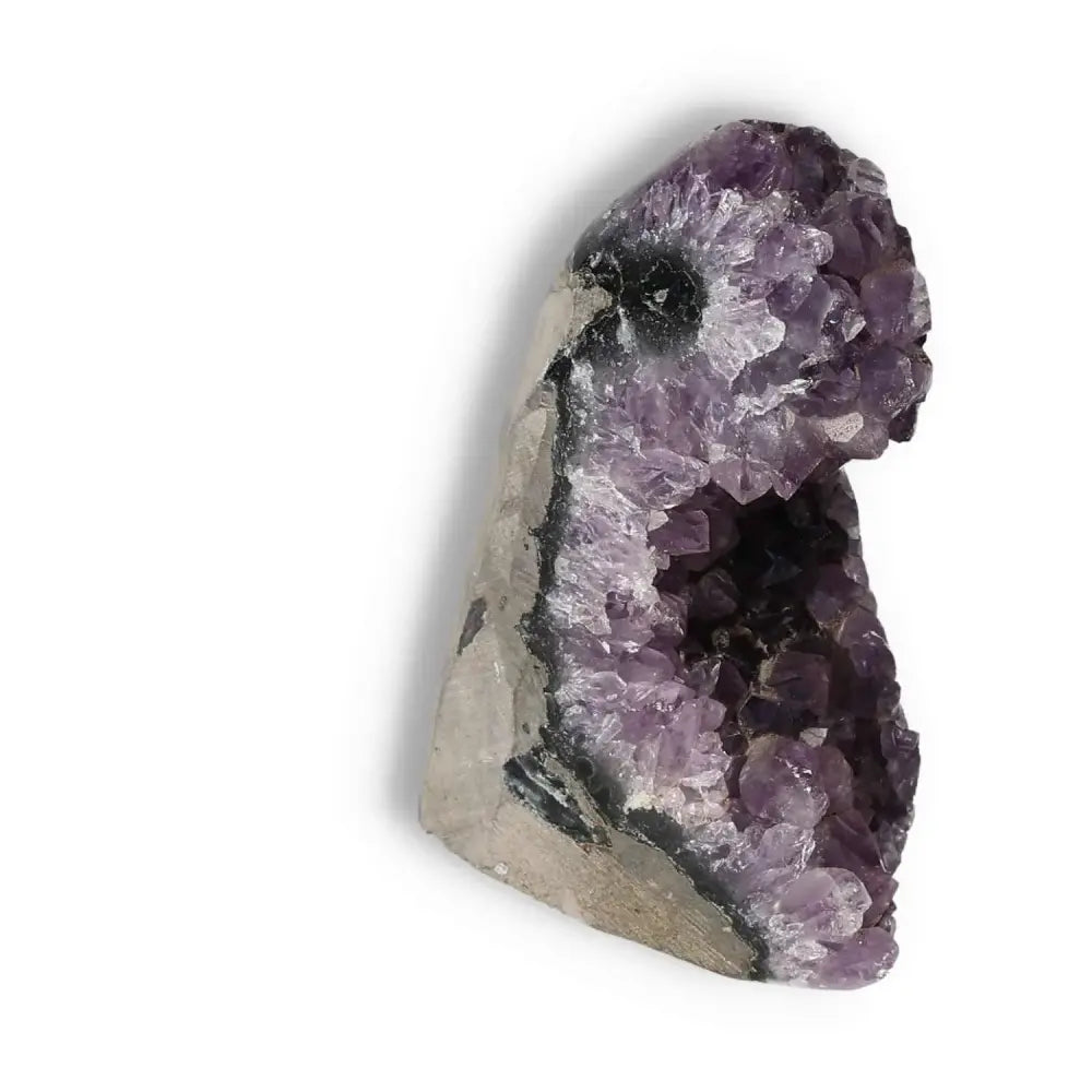 Amethyst cut base geode from Sylvia Crystals showcasing vibrant purple crystals, known for calming energy and spiritual rejuvenation.