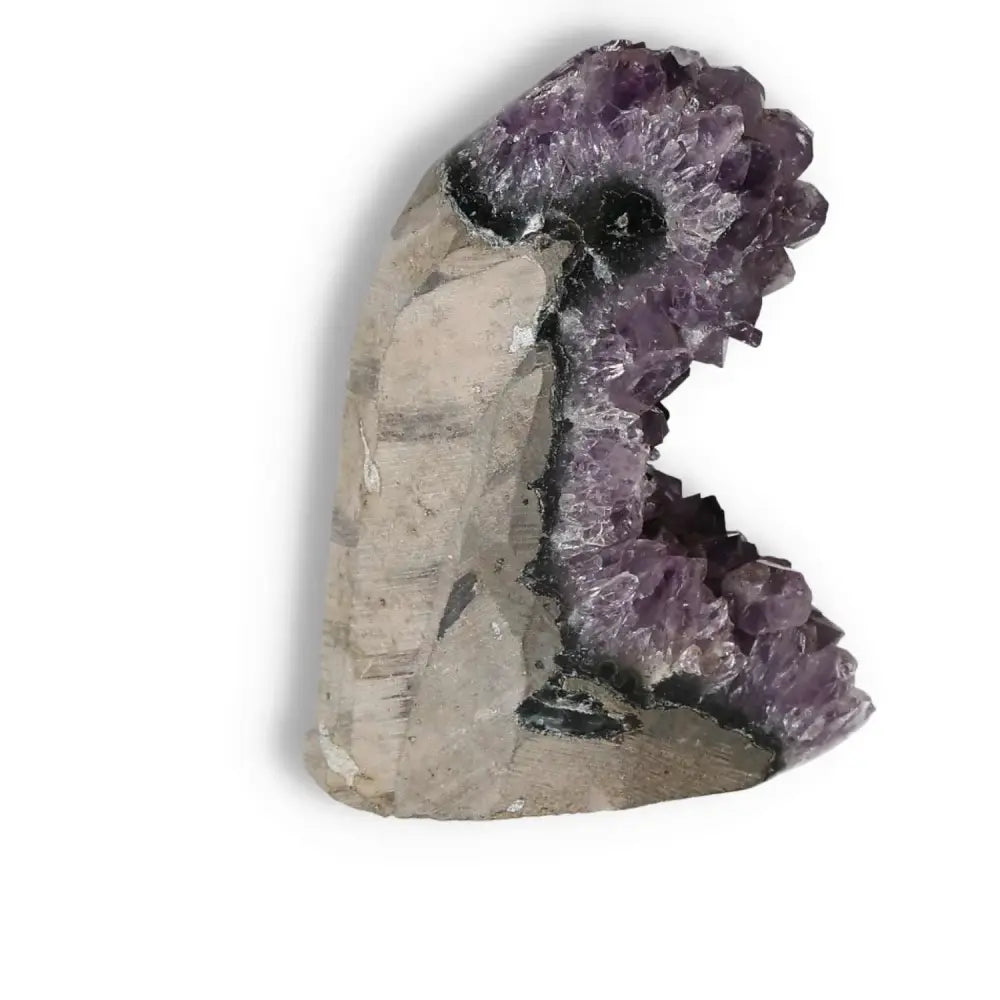 Amethyst cut base geode showcasing vibrant crystals from Sylvia Crystals, known for tranquility and stress relief.