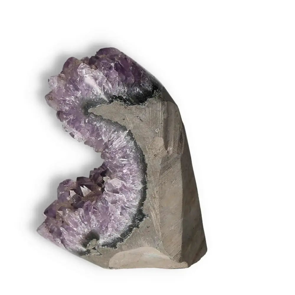 Amethyst cut base geode from Sylvia Crystals, showcasing natural beauty and calming energy for spiritual rejuvenation.