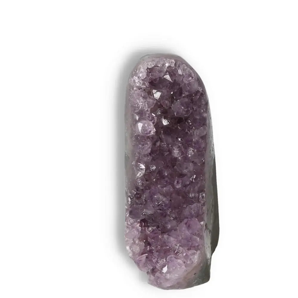 Amethyst Cut Base Geode from Sylvia Crystals showcasing deep purple tones, promoting calm and focus. Perfect for emotional well-being.