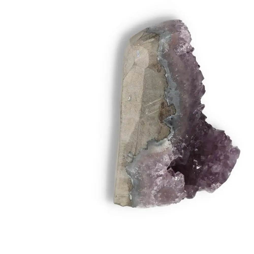 Amethyst cut base geode from Sylvia Crystals, showcasing deep purple hues, known for promoting calm and emotional well-being.