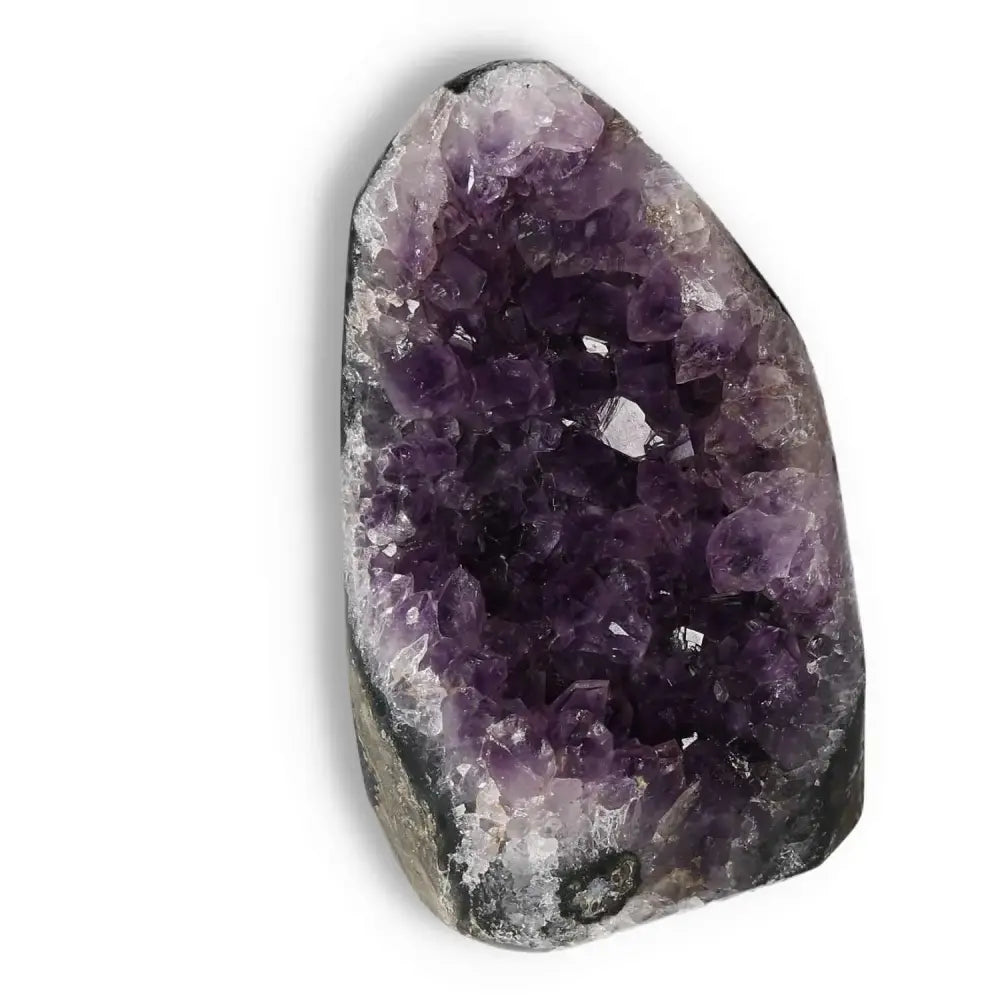 Amethyst cut base geode from Sylvia Crystals showcasing deep purple hues for stress relief and spiritual serenity.