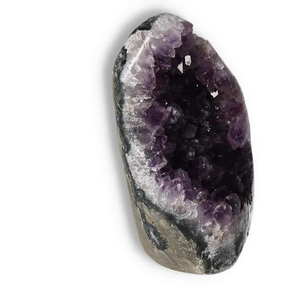 Amethyst cut base geode by Sylvia Crystals, enhancing spiritual serenity and stress relief with emotional stability properties.