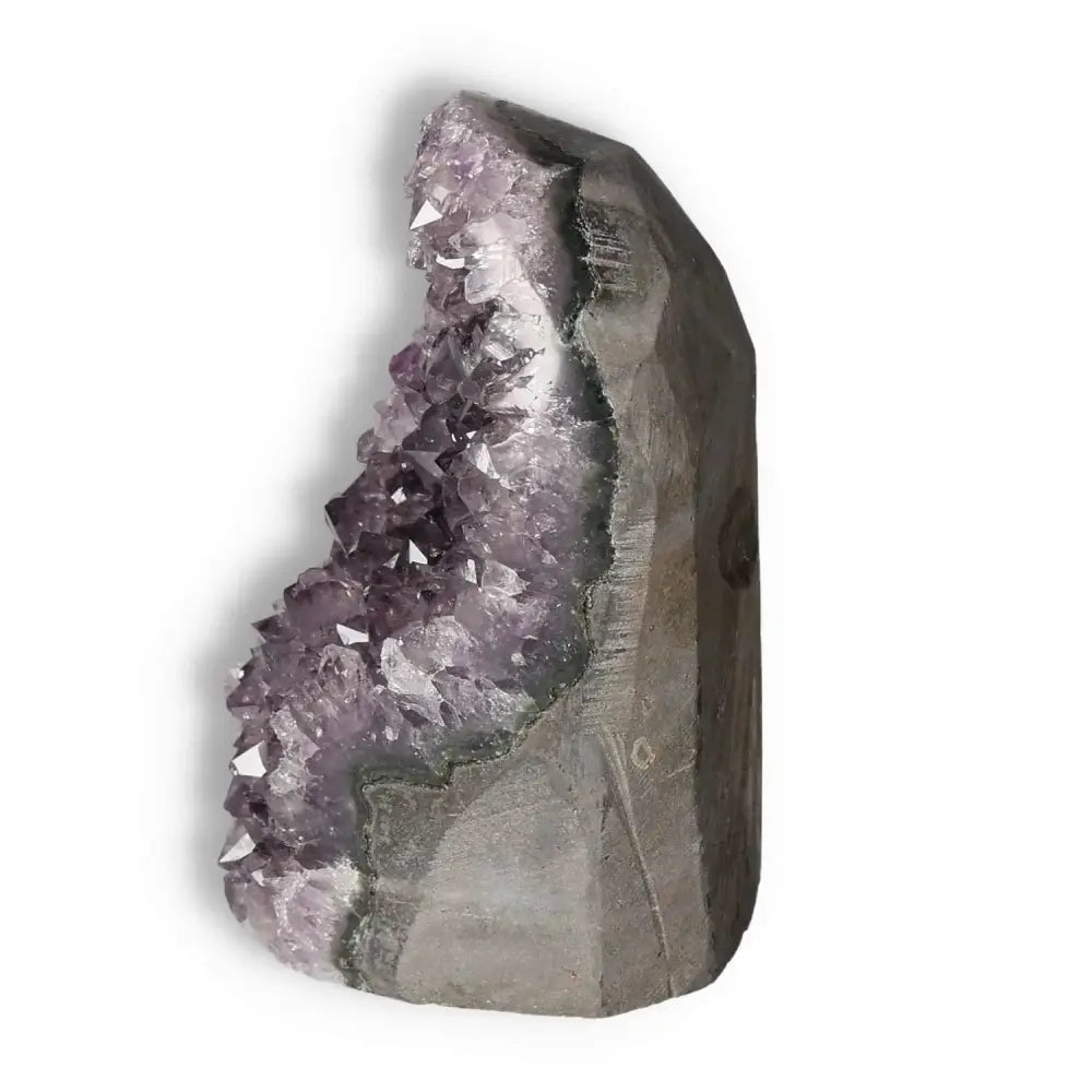 Side view of an Amethyst cut base geode with shimmering purple crystals from Sylvia Crystals, ideal for stress reduction and energy enhancement.