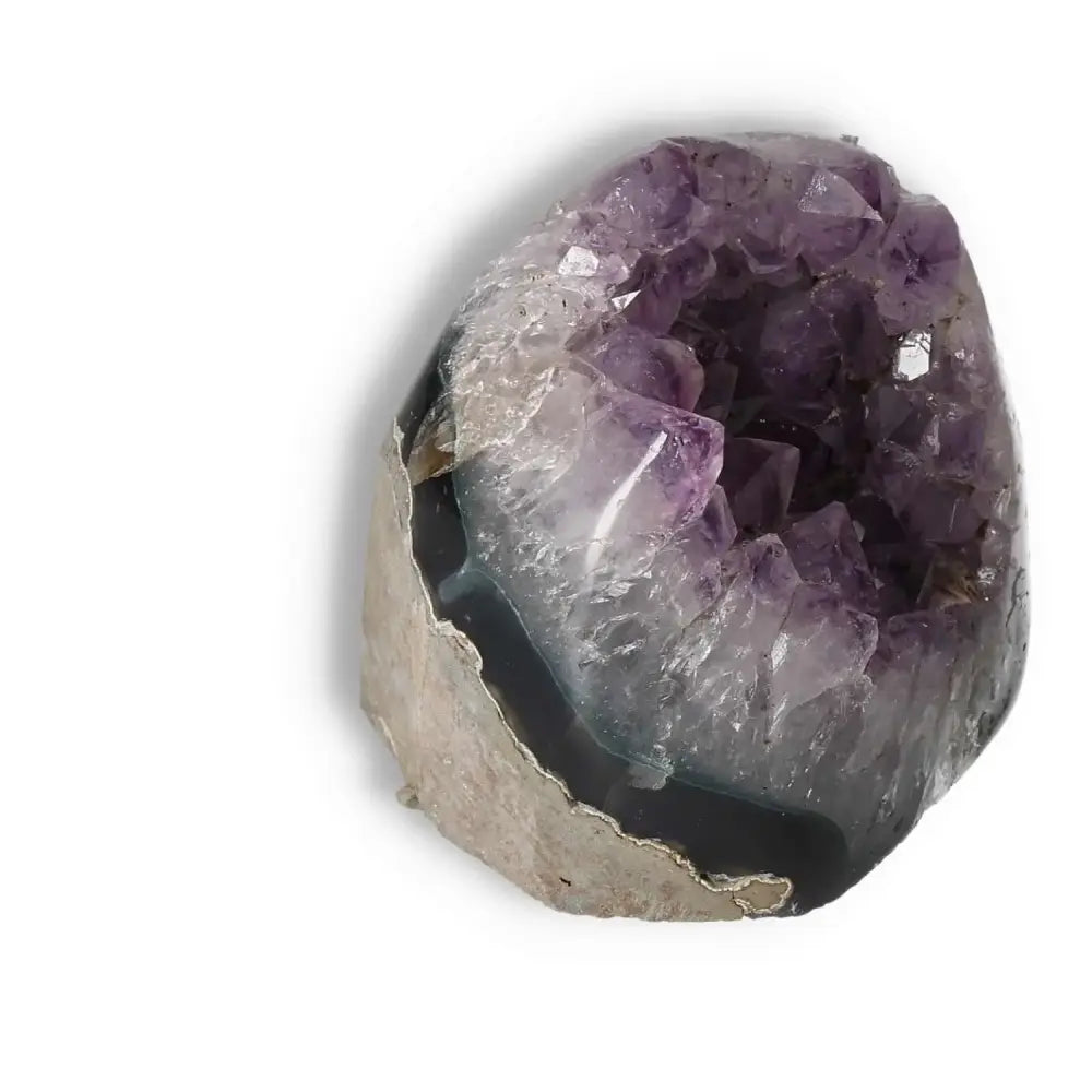 Amethyst cut base geode stone from Sylvia Crystals, known for reducing stress and enhancing energy levels with high-quality craftsmanship.