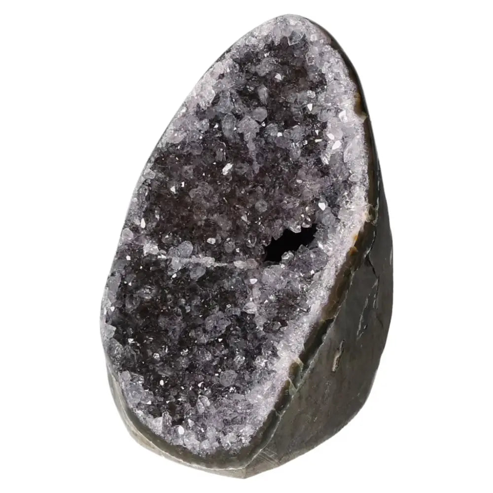 Amethyst cut base geode with sparkling crystal interior, offering positive energy and stress reduction, from Sylvia Crystals.