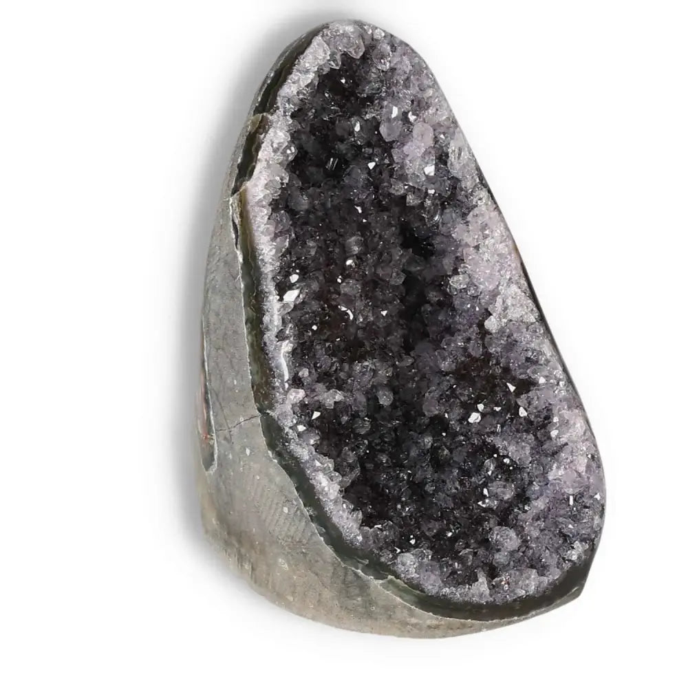 Amethyst cut base geode by Sylvia Crystals, enhances emotional stability and reduces stress with its captivating purple crystal formations.